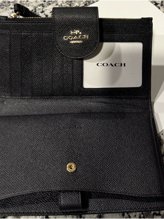 Coach Handbags - Coach Black Leather Bi-Fold Wallet with Gold Accent